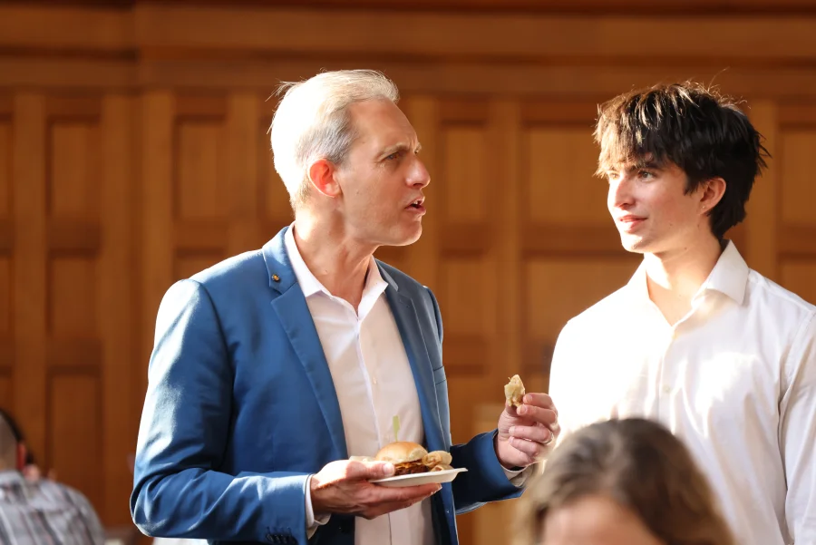 The 2026 Distinguished Faculty Lecturer chats with gues during the reception following the lecture