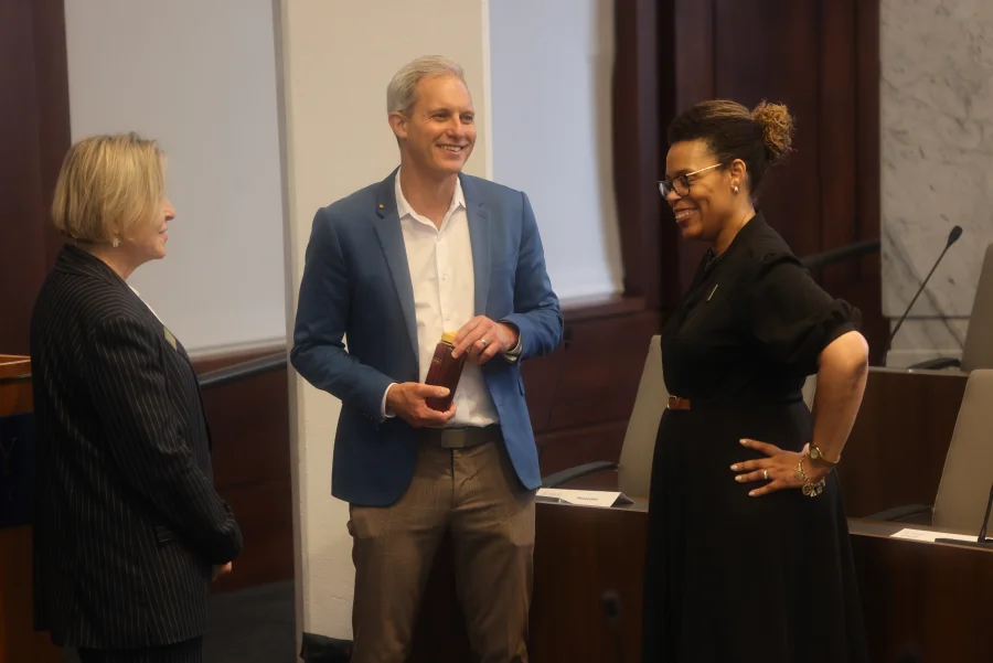 The honoree converses with colleagues after the lecture