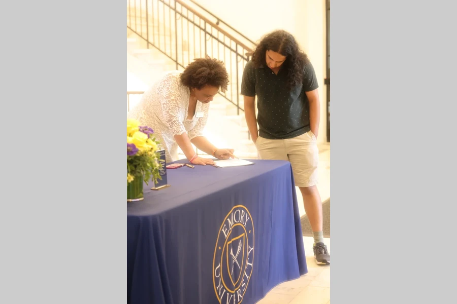 Guests sign in at the Distinguished Faculty Lecture registration table