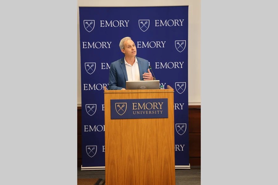 The 2026 Distinguished Faculty Lecturer addresses the audience from the podium